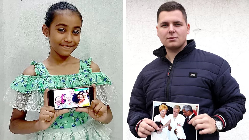 Seven billionth child Sadia Sultana Oishee and six billionth Adnan Mevic holding photos of them with officials at their births